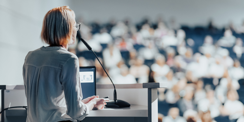 Female,Speaker,Giving,A,Talk,On,Corporate,Business,Conference.,Unrecognizable