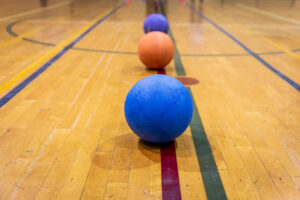 Rubber,Balls,Placed,On,A,Line,On,The,Wooden,Floor